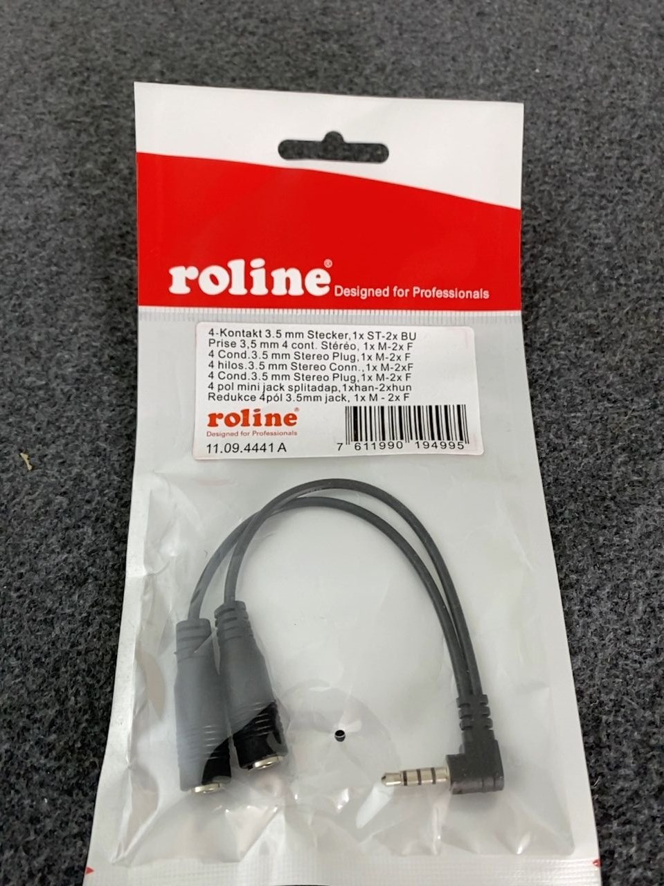 Audio adaptér, slouží pro připojení zařízení sluchátek a mikrofonu Roline